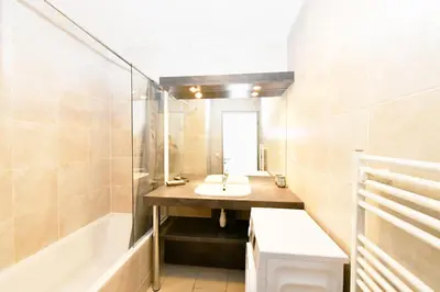 a bathroom with a sink and a bath tub at The Old Port chez Antonella in Cannes