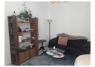 a living room with a couch and a table at Centre heart of CAnnes in Cannes