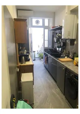 a kitchen with a sink and a stove top oven at Centre heart of CAnnes in Cannes