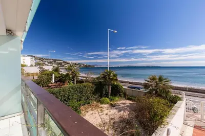 a view of the beach from the balcony of a condo at Bright two bedroomed apartment on the beach in Cannes with huge terrace with fabulous sea views - 2001 in Cannes