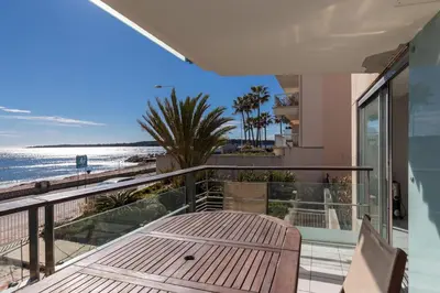 a balcony with a view of the beach at Bright two bedroomed apartment on the beach in Cannes with huge terrace with fabulous sea views - 2001 in Cannes