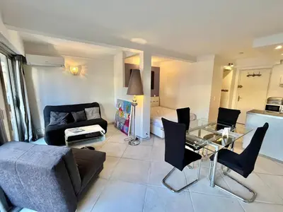 a living room with a couch and a glass table at Rouaze 2, by Welcome to Cannes in Cannes