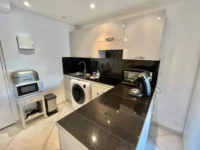 a kitchen with a washer and dryer in it at Rouaze 2, by Welcome to Cannes in Cannes