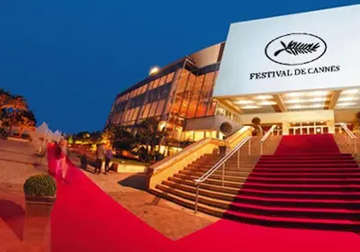 a woman on a red carpet in front of a building at Cannes center - very practical - all comfort in Cannes
