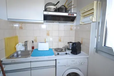 a small kitchen with a sink and a stove at Cannes studio ideal for congresses or holidays in Cannes