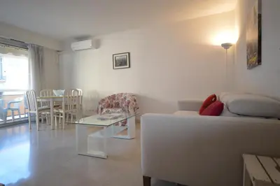 a living room with a couch and a table at Cannes studio ideal for congresses or holidays in Cannes