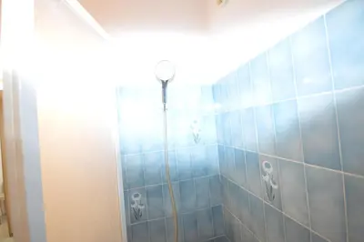 a bathroom with a shower with blue tiles at Cannes studio ideal for congresses or holidays in Cannes