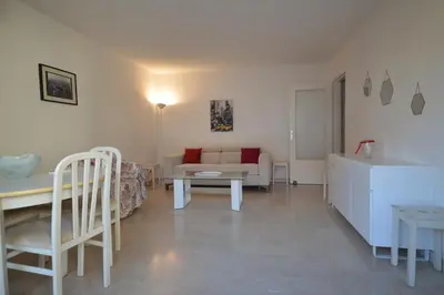 a living room with a couch and a table at Cannes studio ideal for congresses or holidays in Cannes
