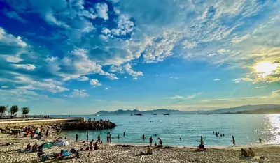 a group of people on a beach near the water at Cannes studio ideal for congresses or holidays in Cannes