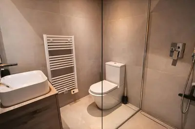 a bathroom with a toilet and a sink and a shower at Incroyable 4P Vue Mer Panoramique in Cannes