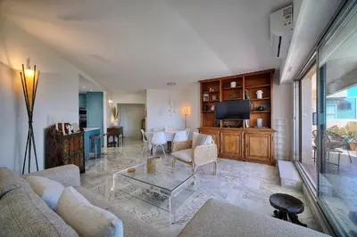 a living room with a couch and a table at Somptueux 2 chambres vue MER, TERRASSE, PARKING A2B232 in Cannes