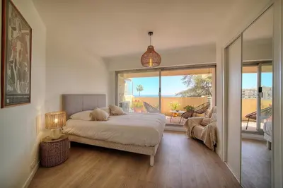 a bedroom with a bed and a large window at Somptueux 2 chambres vue MER, TERRASSE, PARKING A2B232 in Cannes