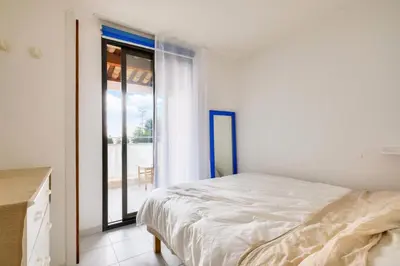 a bedroom with a bed and a large window at Résidence Cannes Villa Francia - maeva Home - Appartement climatisé avec vue mer 2 pièces 4 personnes - Prestige - super Home MAE-2644 in Cannes