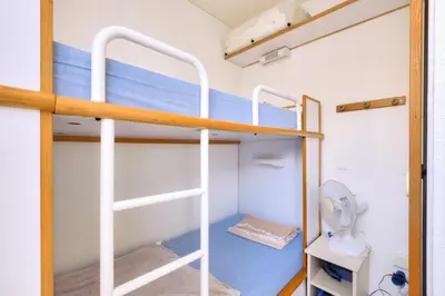 a bunk bed in a room with a toilet at Résidence Cannes Villa Francia - maeva Home - Appartement climatisé avec vue mer 2 pièces 4 personnes - Prestige - super Home MAE-2644 in Cannes