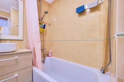 a bathroom with a tub and a sink and a shower at Résidence Cannes Villa Francia - maeva Home - Appartement climatisé avec vue mer 2 pièces 4 personnes - Prestige - super Home MAE-2644 in Cannes