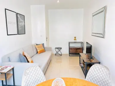 a living room with a couch and a table at 2 Bedroom flat Cannes Center La Croisette Banane in Cannes