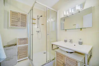 a bathroom with a sink and a shower at 2 bedroom luxury flat with Balcony Cannes Center in Cannes