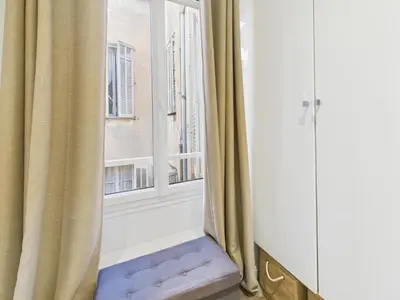 an open window with a stairway in front of it at LE SPECTACULAIRE moderne et raffiné, idéalement situé à deux pas du Palais et plages in Cannes