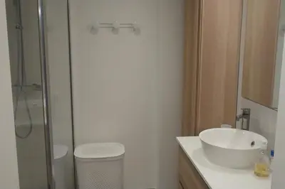 a bathroom with a toilet and a sink and a shower at Spacious 70 m flat with Balcony and sea view! in Cannes