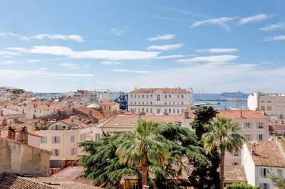 a view of a city with palm trees and buildings at Bronze in Cannes