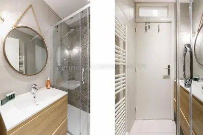a bathroom with a shower and a sink and a mirror at Bronze in Cannes