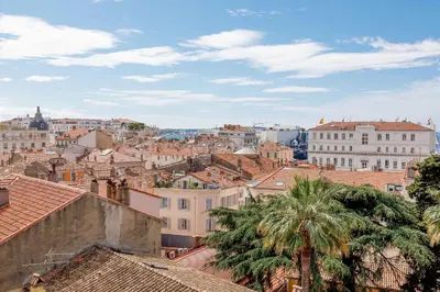 a view of a city with buildings and palm trees at Bronze in Cannes