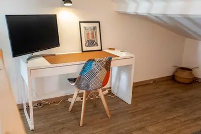 a dining room and living room with a table and chairs at Montgolfiere Apartment by Connexion in Cannes