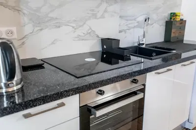a kitchen with a sink and a counter top at Montgolfiere Apartment by Connexion in Cannes