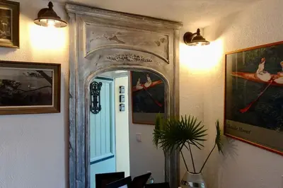 a mirror on a wall in a room at Studio Suquet 1 in Cannes