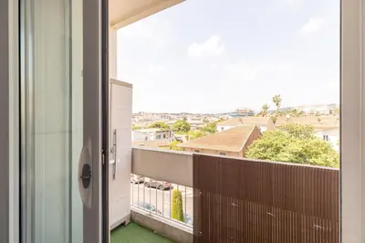 a balcony with a view of a city at Hayda - Proche plage et congrès in Cannes