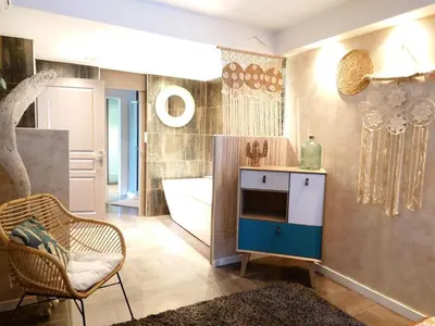 a bathroom with a tub and a sink and a bath room at SUNRISE & SUNSET PALM BEACH CROISETTE in Cannes