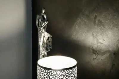 a statue of a person standing on a wall at Studio Suquet 3 in Cannes