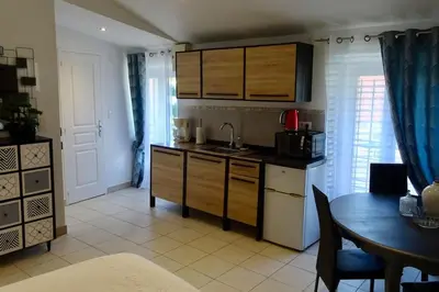 a kitchen with a sink and a table with a tableablish at Studio Suquet 3 in Cannes