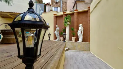 a street light on a wooden deck with statues at Studio Suquet 2 in Cannes