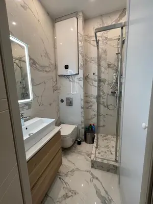 a bathroom with a toilet and a sink and a shower at Newly Renovated Luxury Suite in the Center of Cannes in Cannes