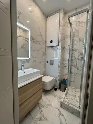 a bathroom with a sink and a toilet at Newly Renovated Luxury Suite in the Center of Cannes in Cannes