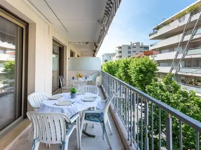 a balcony with a table and chairs at Apartment Le Valencia by Interhome in Cannes