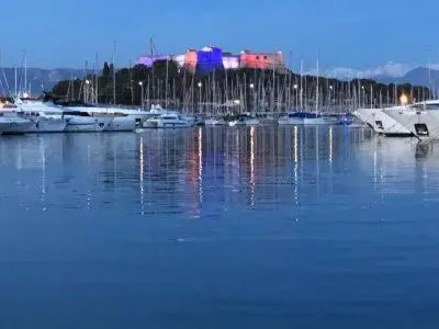 a harbor with boats in the water at night at Sainte Rosalie in Cannes