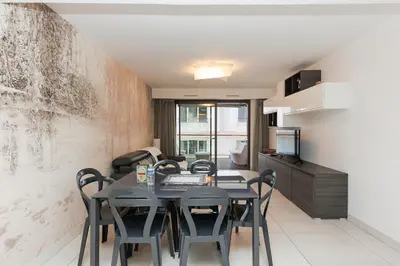 a kitchen and dining room with a table and chairs at 7 Croisette 7C201 in Cannes