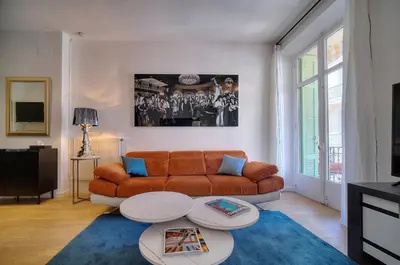 a living room with a couch and a table at Superbe 2 chambres BALCON, COEUR DE CANNES- CENTRE VILLE A2B233 in Cannes