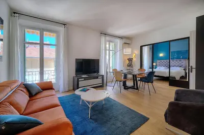 a living room with a couch and a table at Superbe 2 chambres BALCON, COEUR DE CANNES- CENTRE VILLE A2B233 in Cannes