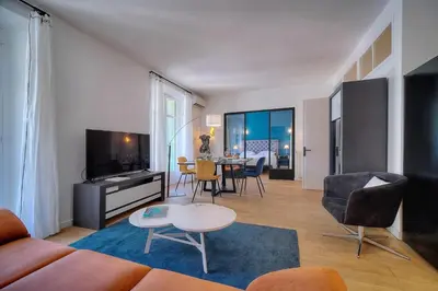 a living room with a couch and a table at Superbe 2 chambres BALCON, COEUR DE CANNES- CENTRE VILLE A2B233 in Cannes