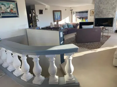 a dining room with a white table and blue chairs at Villa Galateias, un coin de Paradis, superbe vue avec piscine privée in Cannes