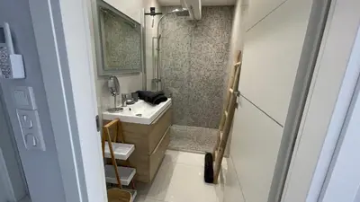 a bathroom with a sink and a shower at Cannes Pointe Croisette : superbe logement vue mer in Cannes