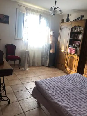 a bedroom with a bed and a window at Maison au calme avec jardin et garage proche du centre et de la mer in Cannes
