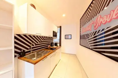 a kitchen with a restaurant sign on the wall at VILLA MARINA CANNES in Cannes
