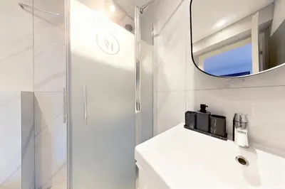 a bathroom with a mirror and a sink at VILLA MARINA CANNES in Cannes