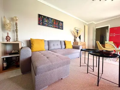 a living room with a couch and a table at RoofTop Apartement - Quartier Croisette - Esc'Appart in Cannes