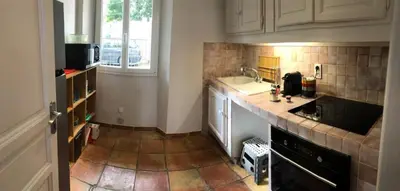 a kitchen with a sink and a counter top at Old city - very charming 1-bedroom apt in Cannes