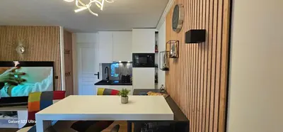 a kitchen with a white table in a room at Villa Francia, Cannes,minimum 5 nuits de sejour in Cannes